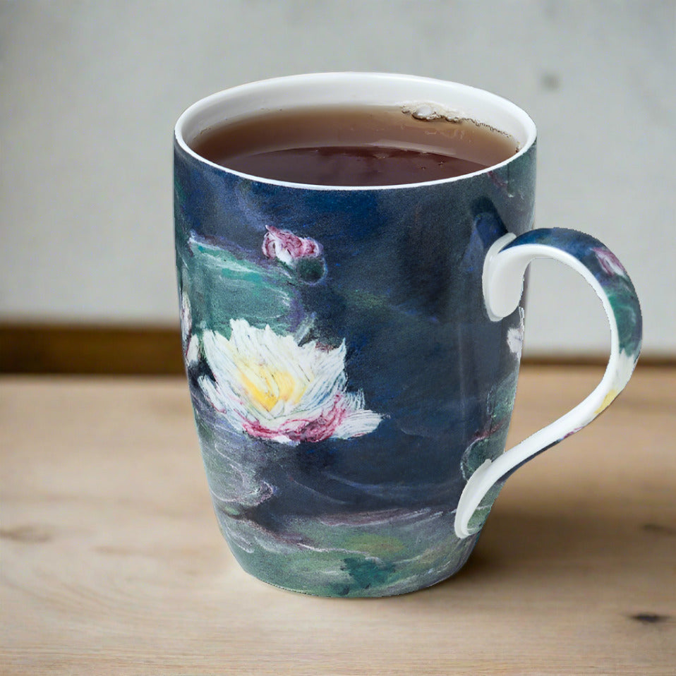Claude Monet Water Lilies Tea Mug in fine bone china, lifestyle image styled on a dining table with tea