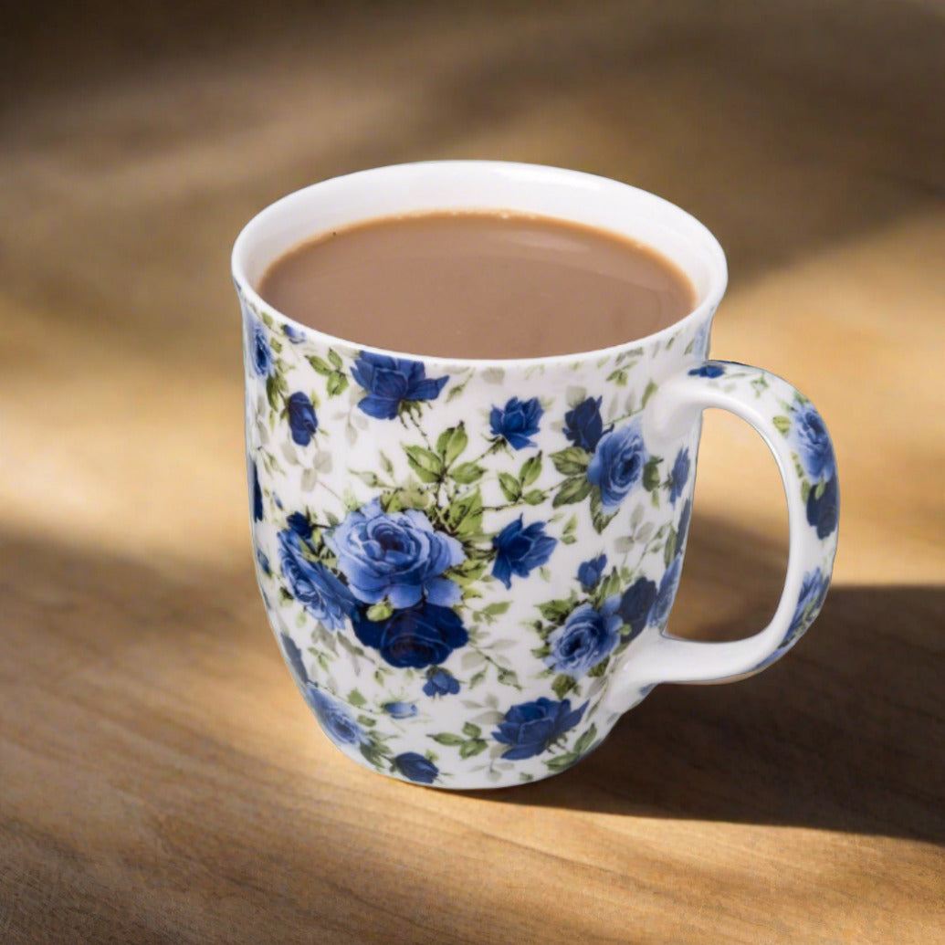 Pretty Chintzy Collection Dark Blue Roses Java mug with coffee in a sunlit setting