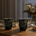 Set of two Starry Night Fine Art Van Gogh Latte mugs displayed in an evening setting