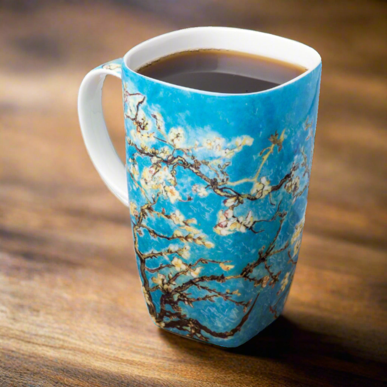 Van Gogh Almond Blossom Grande Mug, lifestyle image styled on a table, with coffee