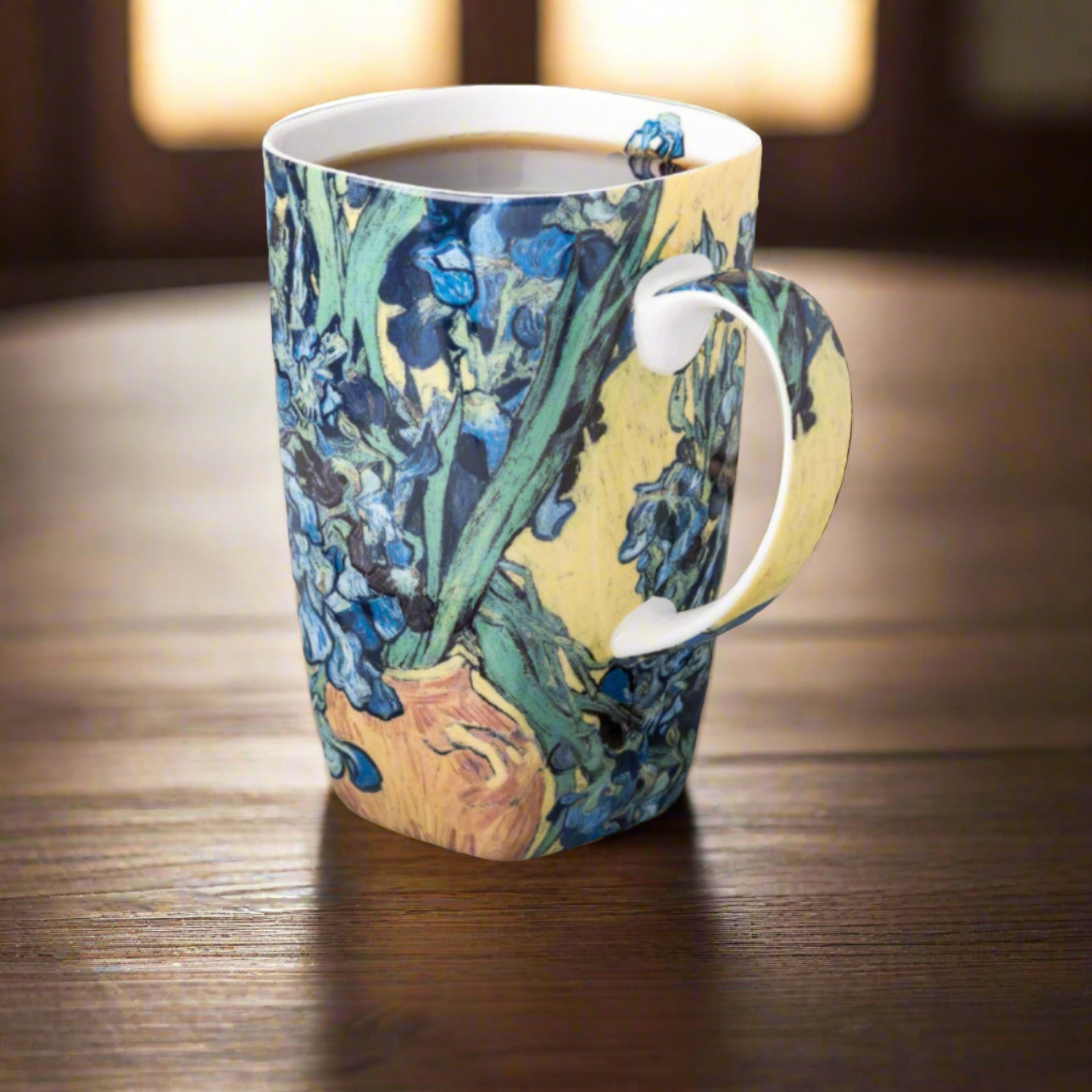 Van Gogh Irises Grande Mug, lifestyle image styled on a table, with coffee