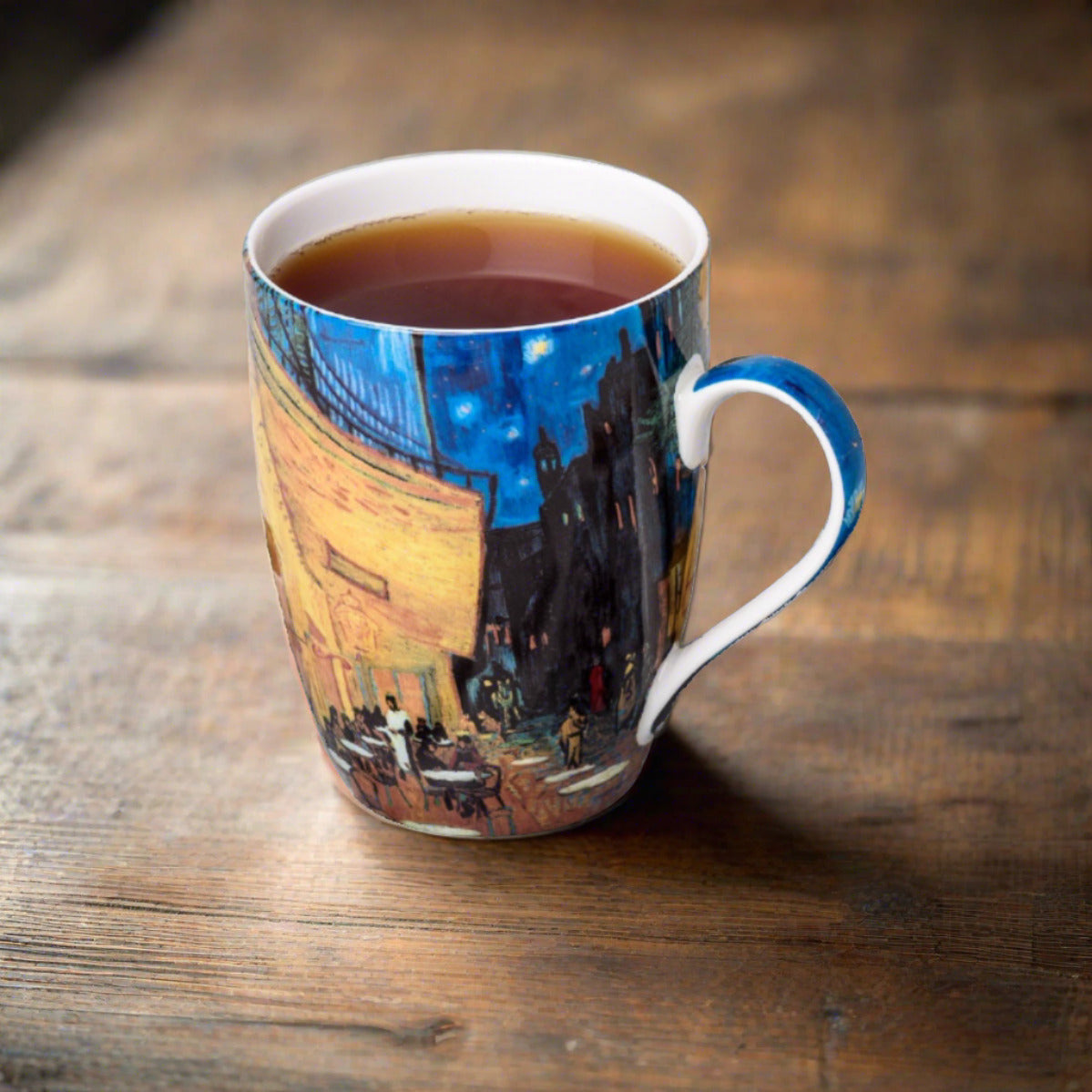 Van Gogh Café Terrace at Night Tea Mug in fine bone china, lifestyle image styled on a dining table with tea