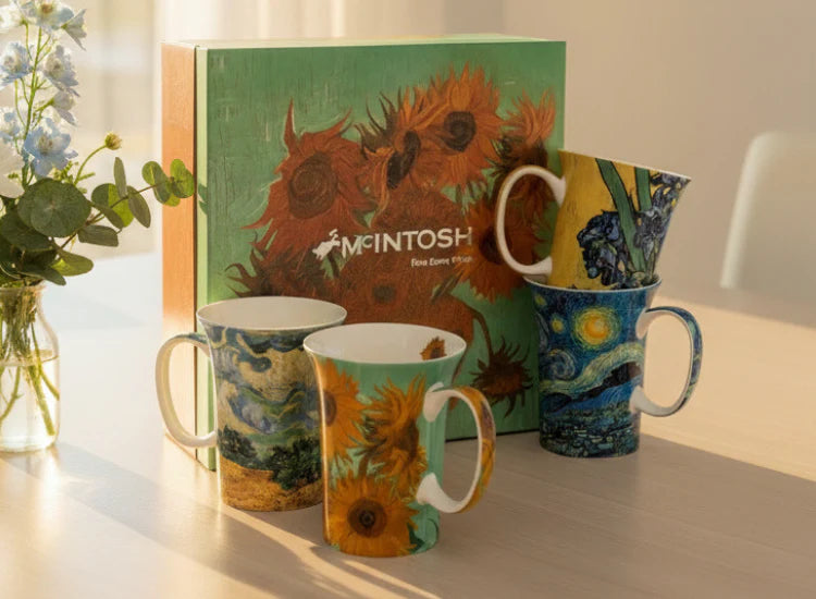 Monet set of 4 mugs with a gift box on a dining table
