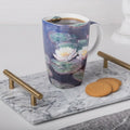 Fine bone china Grande mug featuring Monet Water Lilies artwork, shown with coffee in a clean, styled setting