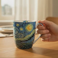 Van Gogh Starry Night Latte mug shown in a cozy home setting
