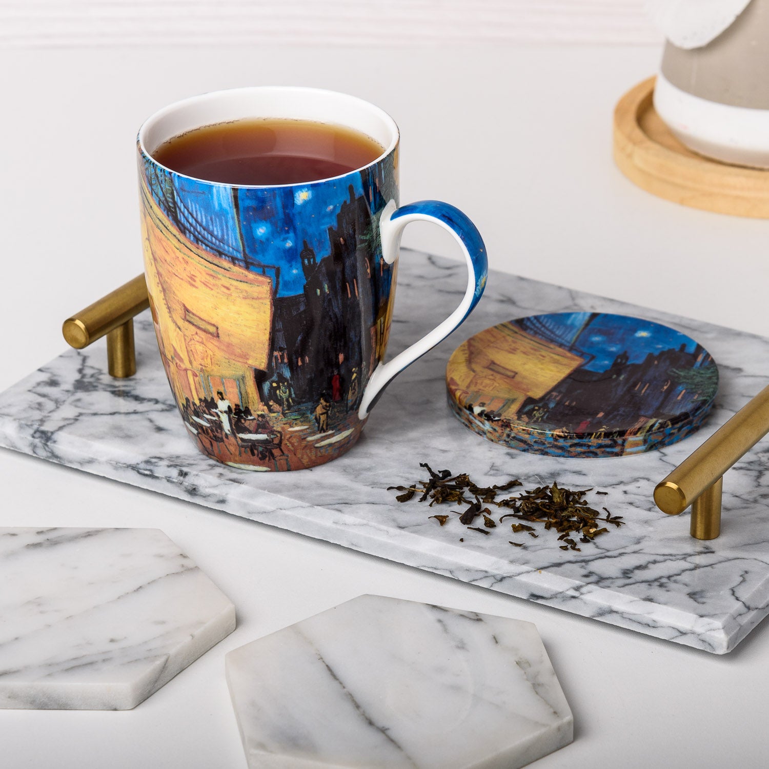Van Gogh Café Terrace at Night Tea Mug in fine bone china, lifestyle image styled on a countertop with tea